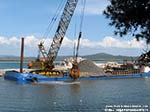 Porto Pino - lavori canale - 15.04.2011 - La draga estrae la sabbia dall'imboccatura del canale
