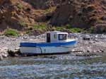 Capo Teulada - 2007, Cala Aligusta, peschereccio con scritte in arabo abbandonato sulla spiaggia, usato presumibilmente per uno sbarco clandestino